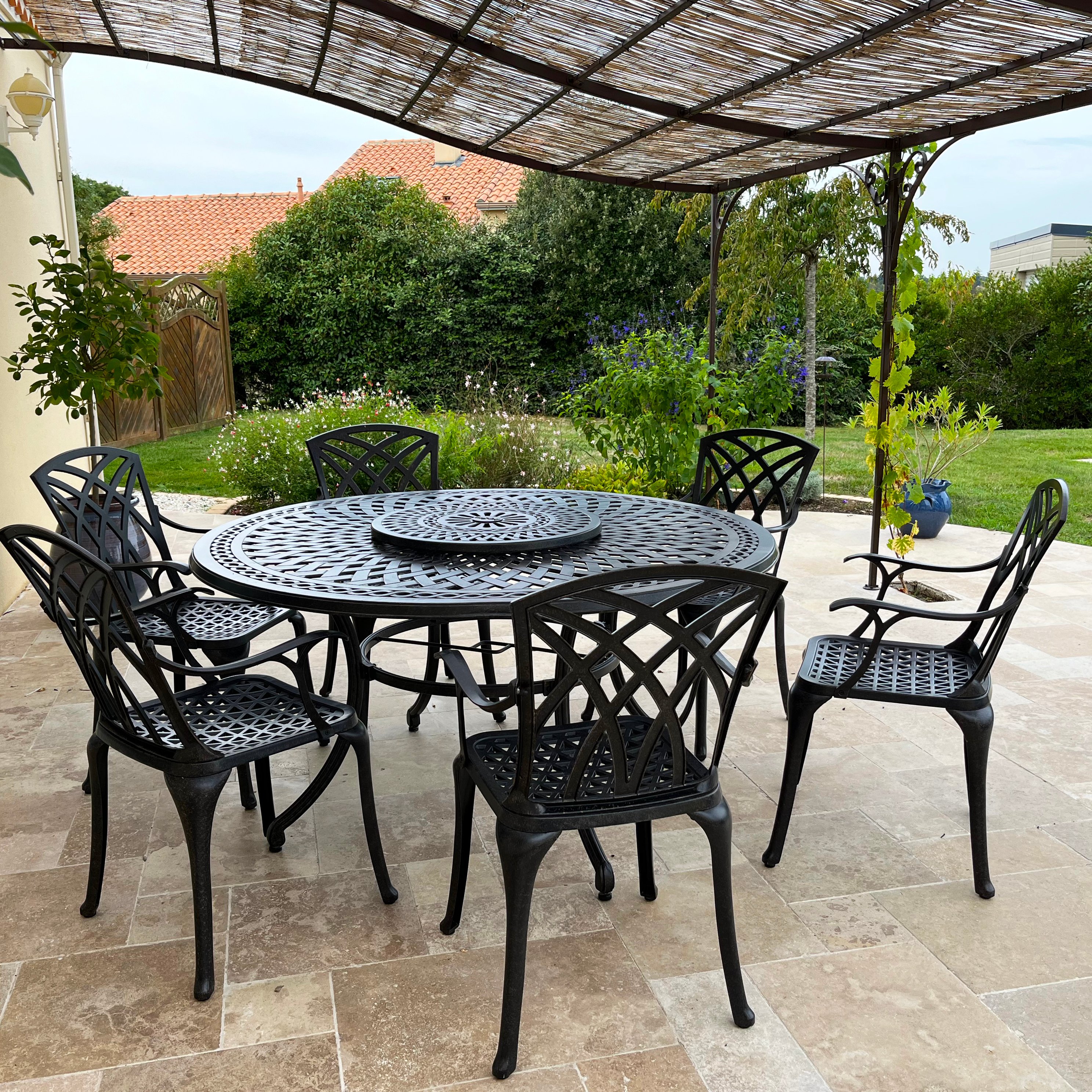 Our Frances Garden Table Set on a Covered Patio